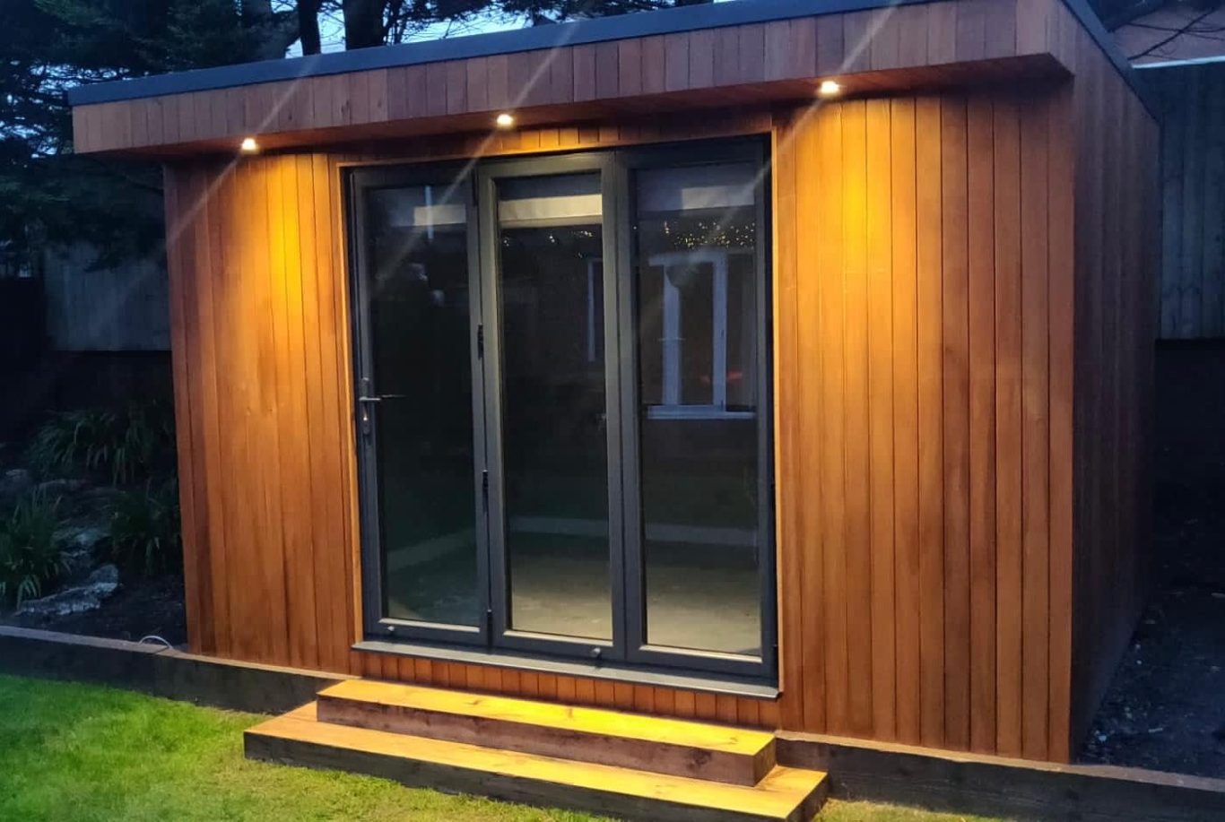 Custom Garden Room – Exterior Timber-clad garden room with glass doors and lighting